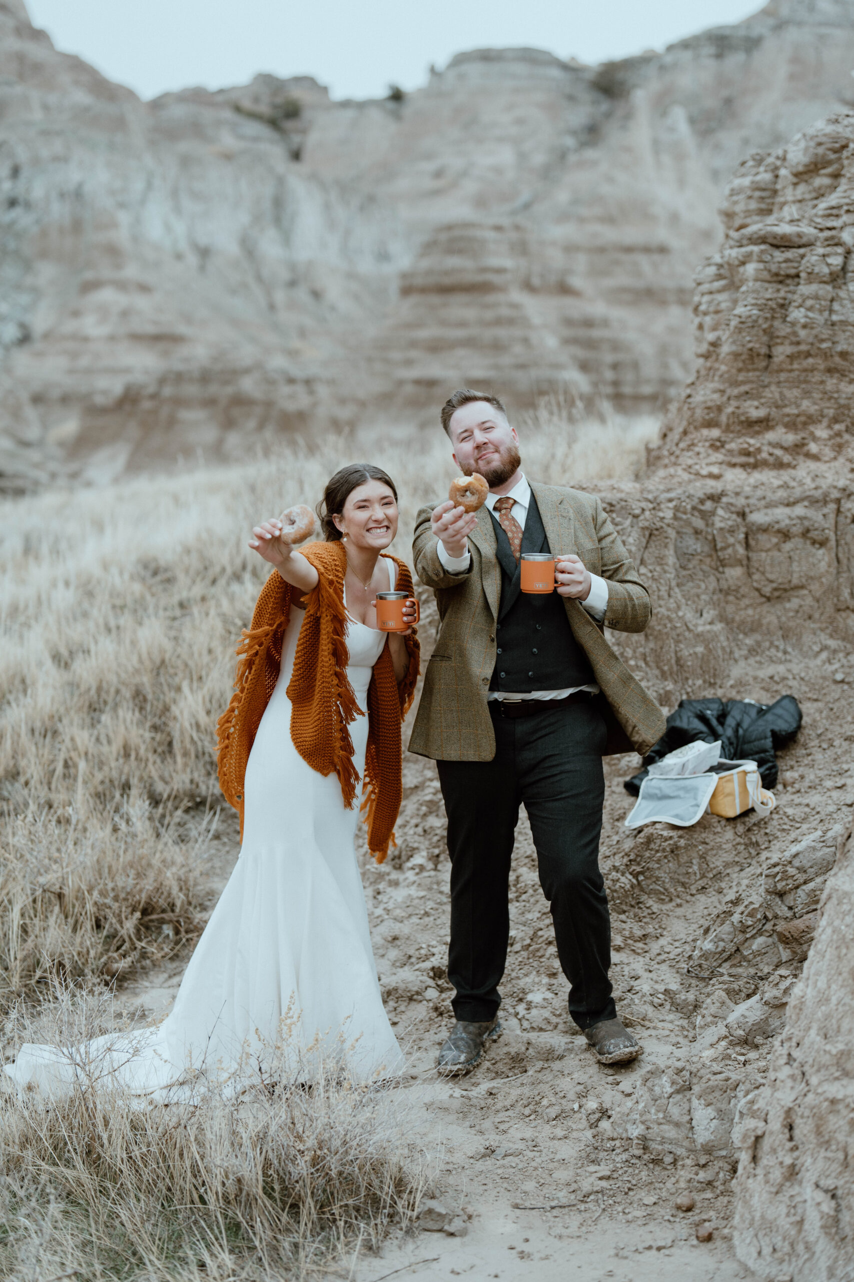 A newly married couple shares donuts after their elopement
