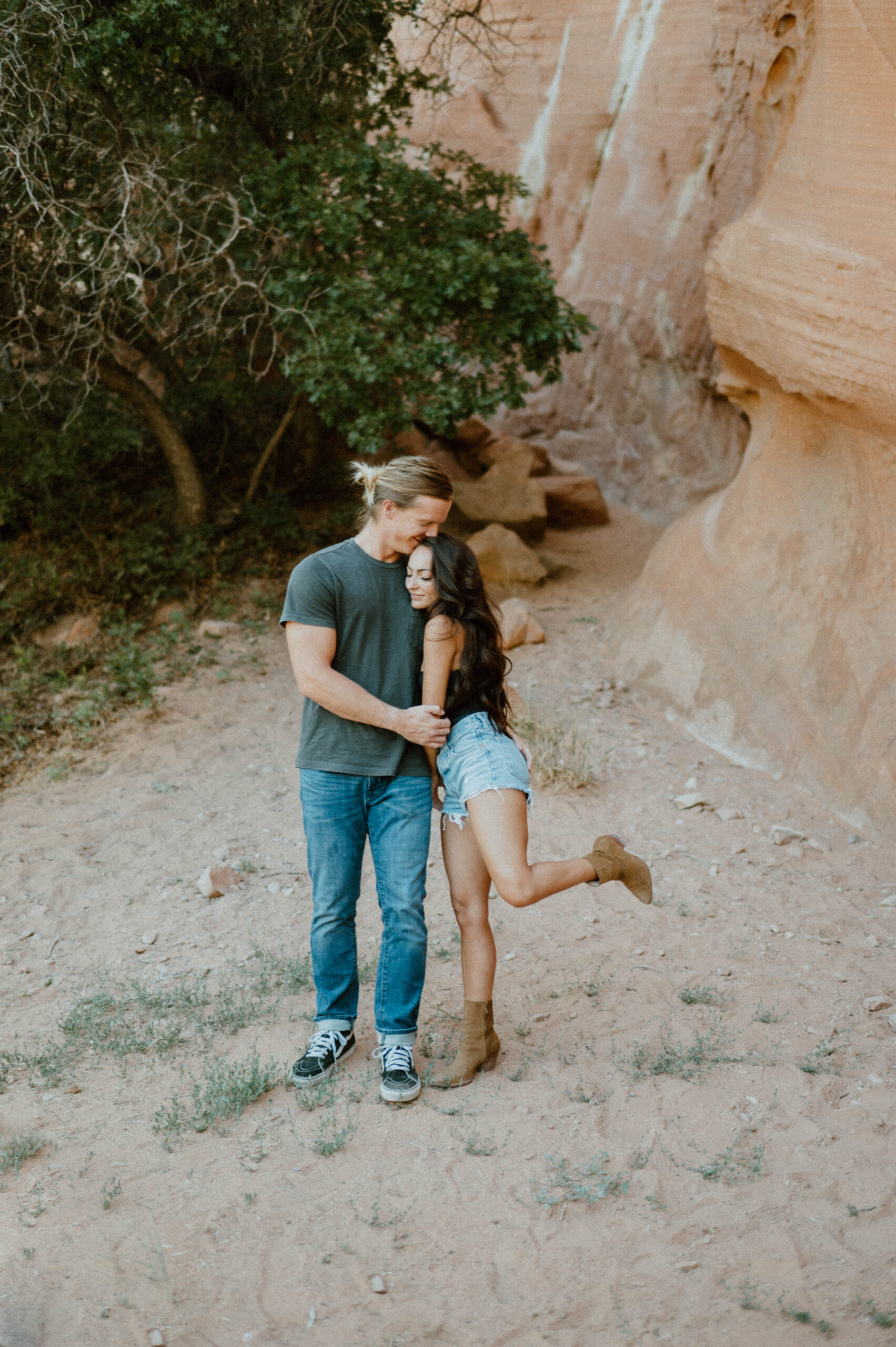 A couple embraces after their red rock elopement in Utah